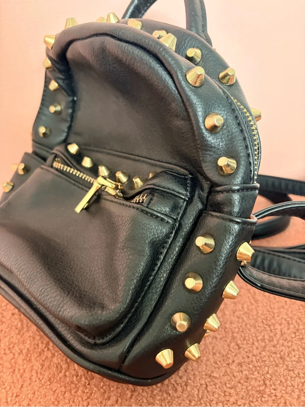 Mini rock n’ roll studded backpack. Vegan leather. Very roomie inside!!